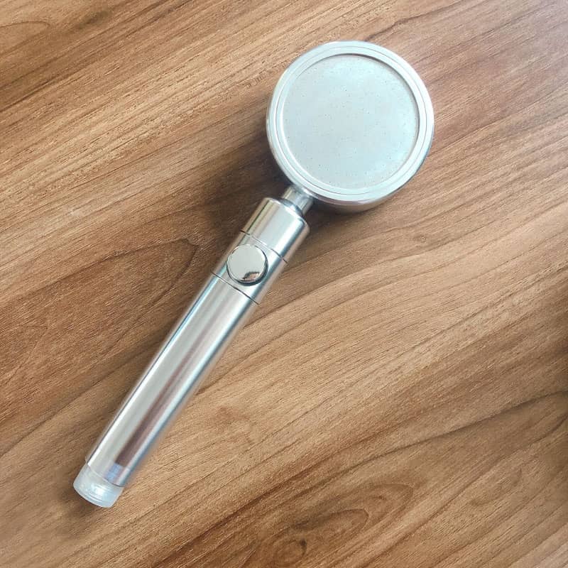 Eco-friendly handheld shower head with mineral beads